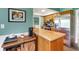 The kitchen features stainless steel refrigerator, and a view of the dining area and appliances at 4500 Great Lake S Dr, Clearwater, FL 33762