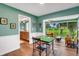 Charming dining area transitions seamlessly to the living room with a view of the outdoor space at 4500 Great Lake S Dr, Clearwater, FL 33762