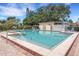 Beautiful community pool with brick accents, surrounded by lush landscaping and comfortable seating at 4500 Great Lake S Dr, Clearwater, FL 33762