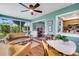 Cozy sunroom features comfortable seating and blends harmoniously with the adjacent kitchen area at 4500 Great Lake S Dr, Clearwater, FL 33762