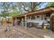 Backyard with outdoor seating area, bar with stools, and grill at 4522 5Th St, Zephyrhills, FL 33542