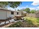 Backyard features a hot tub, and green grass at 4522 5Th St, Zephyrhills, FL 33542