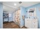 Bathroom features a shower with curtain, and blue painted walls at 4522 5Th St, Zephyrhills, FL 33542