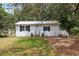 Charming single-story home featuring a white exterior with black shutters at 4522 5Th St, Zephyrhills, FL 33542