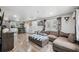 Open-concept living space featuring new laminate flooring and contemporary decor at 4522 5Th St, Zephyrhills, FL 33542