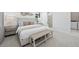 Cozy bedroom featuring a comfortable bed, neutral tones, and modern decor with a connected bathroom and laundry at 4531 Gardner St, Bradenton, FL 34210