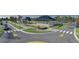 Community street view featuring community buildings, well-maintained landscaping and pedestrian walkways at 4531 Gardner St, Bradenton, FL 34210