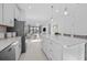 Bright kitchen with island, stainless steel appliances, and views of living space at 4531 Gardner St, Bradenton, FL 34210