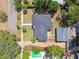 Aerial view of a home with a pool and landscaped yard and detached garage at 4560 7Th N Ave, St Petersburg, FL 33713