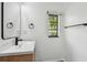 Bright bathroom with sleek vanity, modern fixtures, and window view at 4560 7Th N Ave, St Petersburg, FL 33713