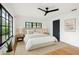 Serene bedroom featuring neutral tones, hardwood floors, and a large window at 4560 7Th N Ave, St Petersburg, FL 33713
