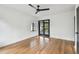 Bedroom showcases hardwood floors, a contemporary ceiling fan, and access to the exterior at 4560 7Th N Ave, St Petersburg, FL 33713