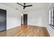 A bright bedroom with hardwood floors and a ceiling fan at 4560 7Th N Ave, St Petersburg, FL 33713