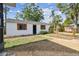 Detached building with new shutters, landscaping, and a brick walkway and small fence at 4560 7Th N Ave, St Petersburg, FL 33713