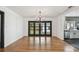 Bright dining room featuring hardwood floors and french doors leading to the backyard at 4560 7Th N Ave, St Petersburg, FL 33713