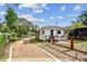Lovely single-story home with a gravel driveway, fenced yard, and well-maintained landscaping at 4560 7Th N Ave, St Petersburg, FL 33713