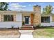 Inviting home exterior showcasing a brick chimney and a covered entryway with stylish accents at 4560 7Th N Ave, St Petersburg, FL 33713
