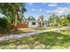 Inviting home showcasing a stone chimney, a privacy fence, and a lovely walkway at 4560 7Th N Ave, St Petersburg, FL 33713