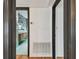 Hallway that offers an entry into the bathroom with bold wallpaper at 4560 7Th N Ave, St Petersburg, FL 33713