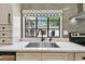 Close-up of a kitchen sink with modern fixtures and a window providing natural light at 4560 7Th N Ave, St Petersburg, FL 33713