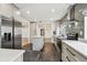 A modern kitchen featuring stainless steel appliances, a center island, and dark tile flooring at 4560 7Th N Ave, St Petersburg, FL 33713