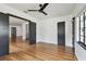Spacious living room with hardwood floors, black door frames, and abundant natural light at 4560 7Th N Ave, St Petersburg, FL 33713