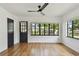 Bright living room with hardwood floors and large windows offering an open view at 4560 7Th N Ave, St Petersburg, FL 33713