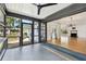 Screened in back porch leads to living room with a fireplace and hardwood floors at 4560 7Th N Ave, St Petersburg, FL 33713