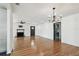 Spacious living room with hardwood floors, fireplace, and contemporary chandelier at 4560 7Th N Ave, St Petersburg, FL 33713
