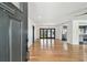 Bright, open-concept living room featuring hardwood floors, modern lighting, and access to the kitchen at 4560 7Th N Ave, St Petersburg, FL 33713