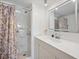 Modern bathroom features a spacious walk-in shower and sleek vanity with ample counter space at 5251 Flint St, Zephyrhills, FL 33542