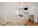 Comfortable bedroom with a bed, dresser, and a window that provides plenty of natural light at 5251 Flint St, Zephyrhills, FL 33542