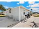 Single-story home has an outdoor patio with seating and a grill, in a well-kept, active community at 5251 Flint St, Zephyrhills, FL 33542