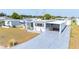 Bright single-story home featuring a covered carport and charming curb appeal in a well-maintained community at 5251 Flint St, Zephyrhills, FL 33542