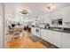 Open concept: Kitchen flows into the dining and living areas, great for entertaining at 5251 Flint St, Zephyrhills, FL 33542