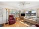 Comfortable living room with ample sunlight, cozy seating, and neutral decor at 5251 Flint St, Zephyrhills, FL 33542