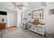 Clean living room featuring an area rug, console table and windows for natural light at 5251 Flint St, Zephyrhills, FL 33542