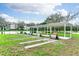 Beautiful outdoor recreational space with benches, a pavilion, and scenic lakeside views at 5251 Flint St, Zephyrhills, FL 33542