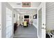 Spacious sunroom with double doors leading to other rooms, perfect for gatherings at 5251 Flint St, Zephyrhills, FL 33542