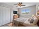 This is a cozy bedroom featuring a wooden bed frame, a window, and a closet at 5804 Butterfield St, Riverview, FL 33578