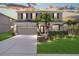 Charming two-story home featuring a well-manicured lawn, beautiful landscaping, and an attached two-car garage at 5804 Butterfield St, Riverview, FL 33578