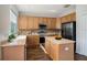 Bright kitchen featuring wooden cabinetry, stainless steel appliances, and laminate countertops at 5804 Butterfield St, Riverview, FL 33578
