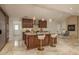 Bright open concept kitchen with an island, seating, and easy access to the backyard at 5823 Dory Way, Tampa, FL 33615
