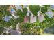 An aerial perspective showcases two houses with lush landscaping and neighborhood streets at 6038 Palomaglade Dr, Lithia, FL 33547