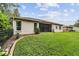 Expansive backyard with lush green grass and privacy fence at 6038 Palomaglade Dr, Lithia, FL 33547