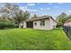 Lush backyard featuring green grass and partial privacy fence at 6038 Palomaglade Dr, Lithia, FL 33547