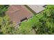 Aerial view of a well-manicured lawn and screened in lanai, perfect for outdoor living at 6038 Palomaglade Dr, Lithia, FL 33547