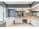 Bathroom featuring granite counters, an undermount sink, and a large tub and shower area at 6038 Palomaglade Dr, Lithia, FL 33547
