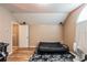 Bedroom area offers wood floors and a futon at 6038 Palomaglade Dr, Lithia, FL 33547