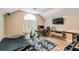 Bedroom area offers wood floors and a futon at 6038 Palomaglade Dr, Lithia, FL 33547